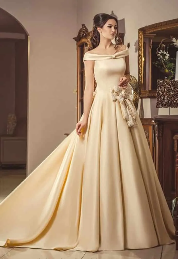 ---Simple A line style champagne wedding dress with drooping straps done in satin--